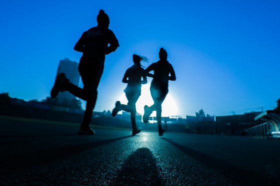 Runner on a track at sunrise