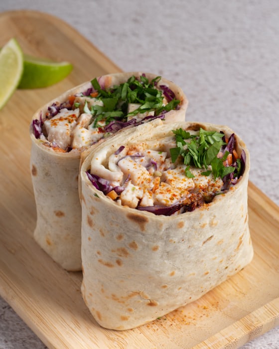 Vegetable wrap with hummus and mixed greens